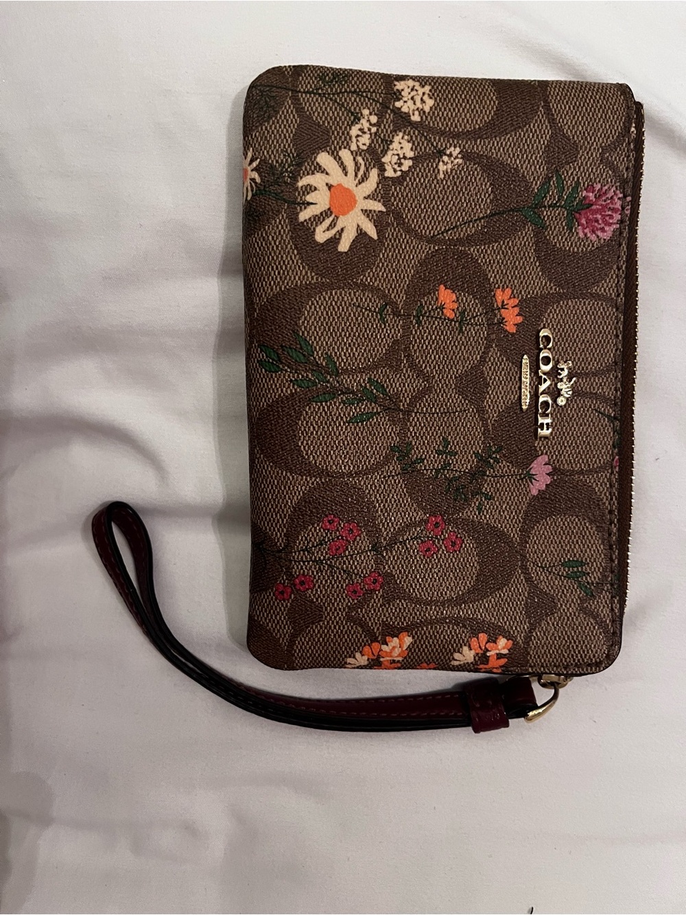 COACH Brown Signature Floral Wristlet with Gold Logo